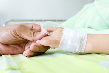 IV solution in a child's patients hand