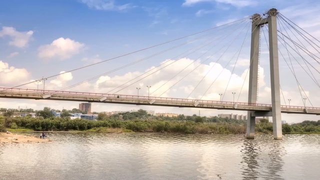 Footbridge over the flow of the Yenisei river