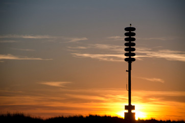 Tsunami warning tower at sunset