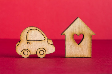 Wooden house with hole in the form of heart with wooden car icon