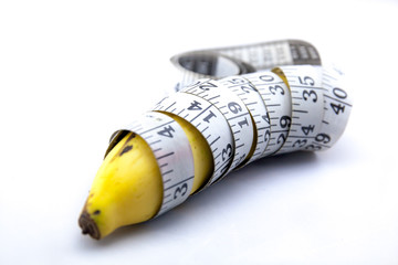 Banana wrapped up with Measure Tape