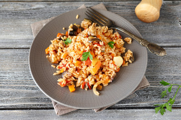 Delicious pilaf with peppers, carrots and tomatoes