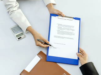 Business person give a contract to sign