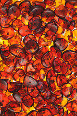 amber stones rectangular closeup lie on a flat surface