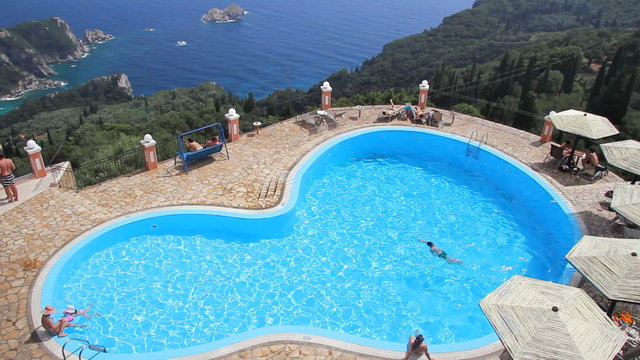 People enjoying on vacation in a swimming pool