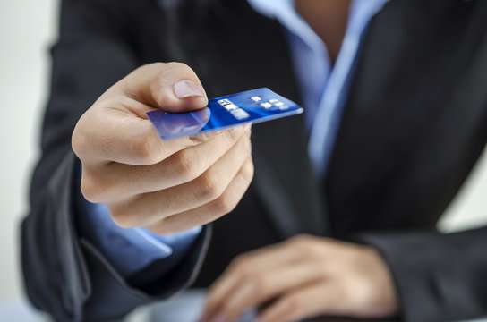 Bank office worker providing credit card