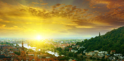 Fototapeta premium city in a mountain valley and sunrise