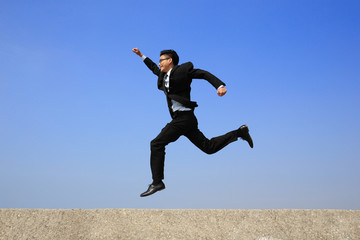 Happy business man run