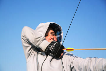 Boy aiming a bow