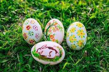 Colorful Easter eggs in a field of grass