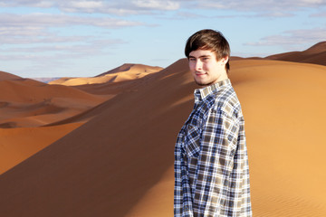 Man alone in the desert on the sand dune