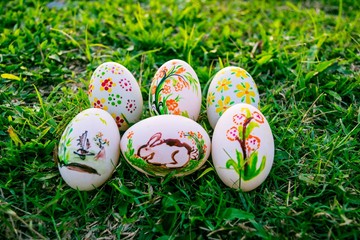 Colorful Easter eggs in a field of grass
