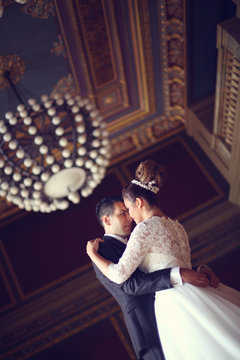 Bride and groom in a palace