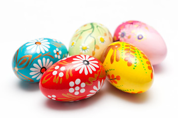 Fototapeta na wymiar Hand painted Easter eggs on white. Spring patterns art, unique.