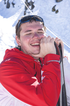 Sportsman taking a deep breath after skiing