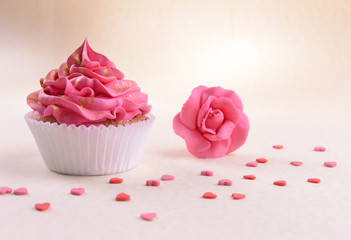 Delicious cupcake on beige background
