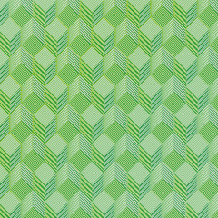 Grüne Würfel auf einem Stoffmuster