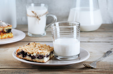 Homemade pies with jam and glass of milk