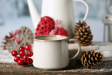 Winter composition with hot beverage on nature background