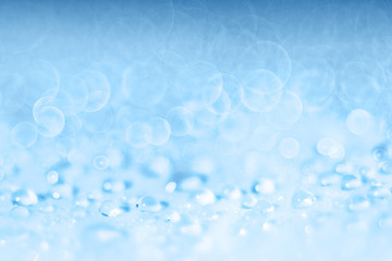 Blue light blurred background texture bokeh drops