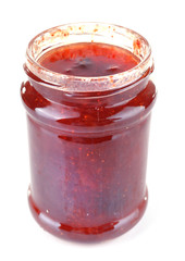 Homemade jar of strawberry jam isolated on white background
