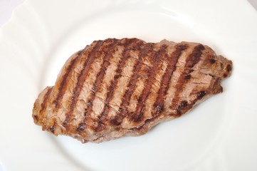 Grilled beef steak on plate