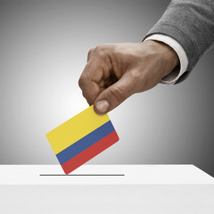 Black male holding flag. Voting concept - Colombia