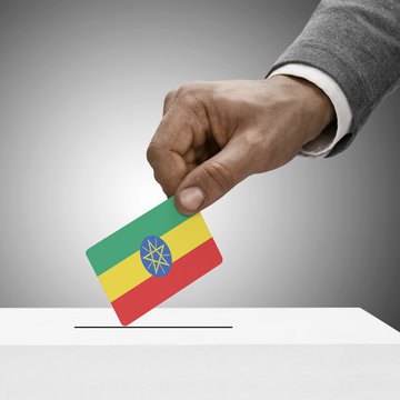 Black male holding flag. Voting concept - Ethiopia