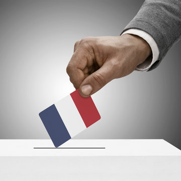 Black male holding flag. Voting concept - France