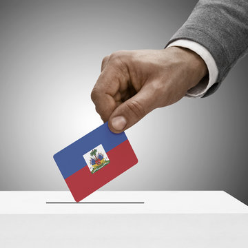 Black male holding flag. Voting concept - Haiti