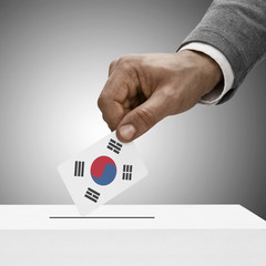 Black male holding flag. Voting concept - South Korea