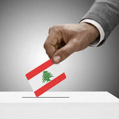Black male holding flag. Voting concept - Lebanon
