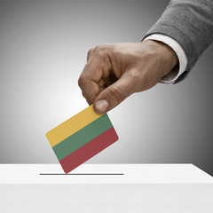 Black male holding flag. Voting concept - Lithuania