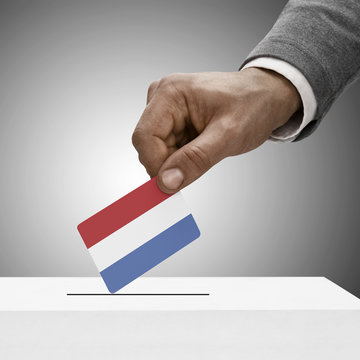 Black male holding flag. Voting concept - Netherlands