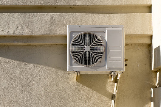 Air conditioner on the wall outdoors in summer. 
