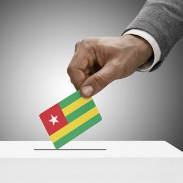 Black male holding flag. Voting concept - Togo