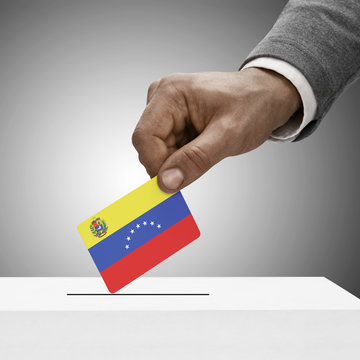 Black male holding flag. Voting concept - Venezuela