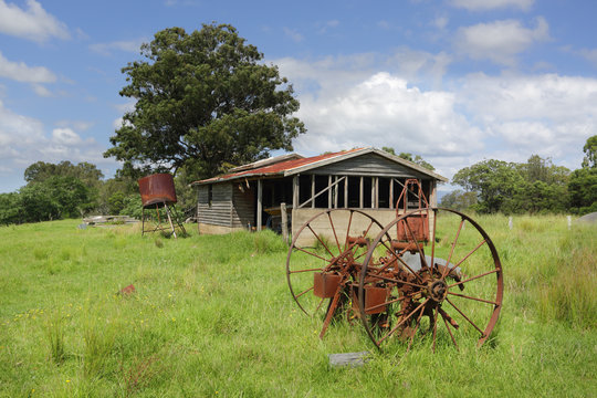 Old derelict farm shed and rusty cart wheels at Benandarah