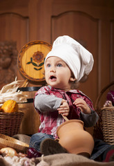 baby in a cook cap
