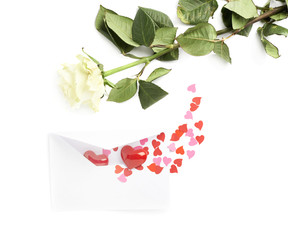 Rose and envelope filled with hearts
