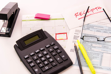 Tax preparation supplies, reading glasses and tax forms