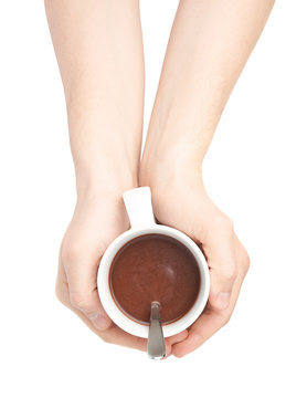 Holding cocoa cup with two hands