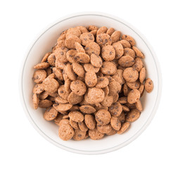 Chocolate flavored breakfast cereal in a white bowl 