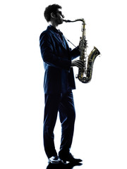 Fototapeta premium man saxophonist playing saxophone player silhouette