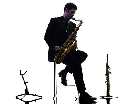 man saxophonist playing saxophone player  silhouette