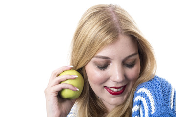 Model Released. Attractive Young Woman Holding a Green Apple