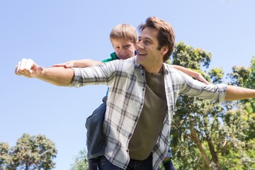 Father and son having fun in the park