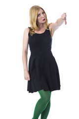 Naklejka premium Model Released. Sad Young Woman Giving Thumbs Down Hand Sign