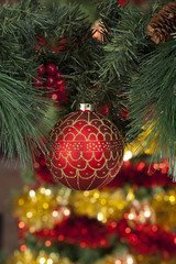 Closeup of red Christmas balls on colored background