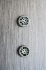 sewing buttons  brushed metal background